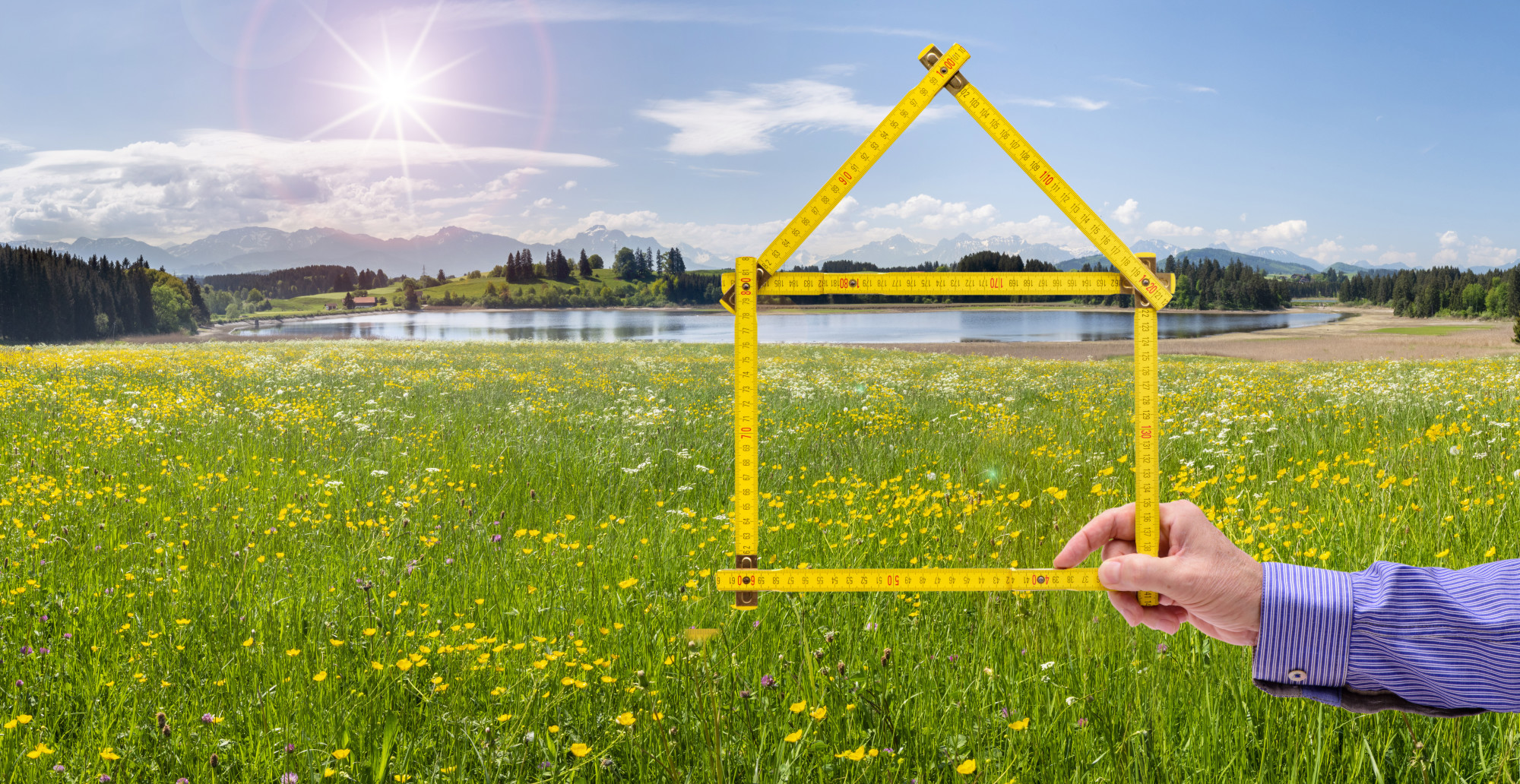 rulers in shape of house in field