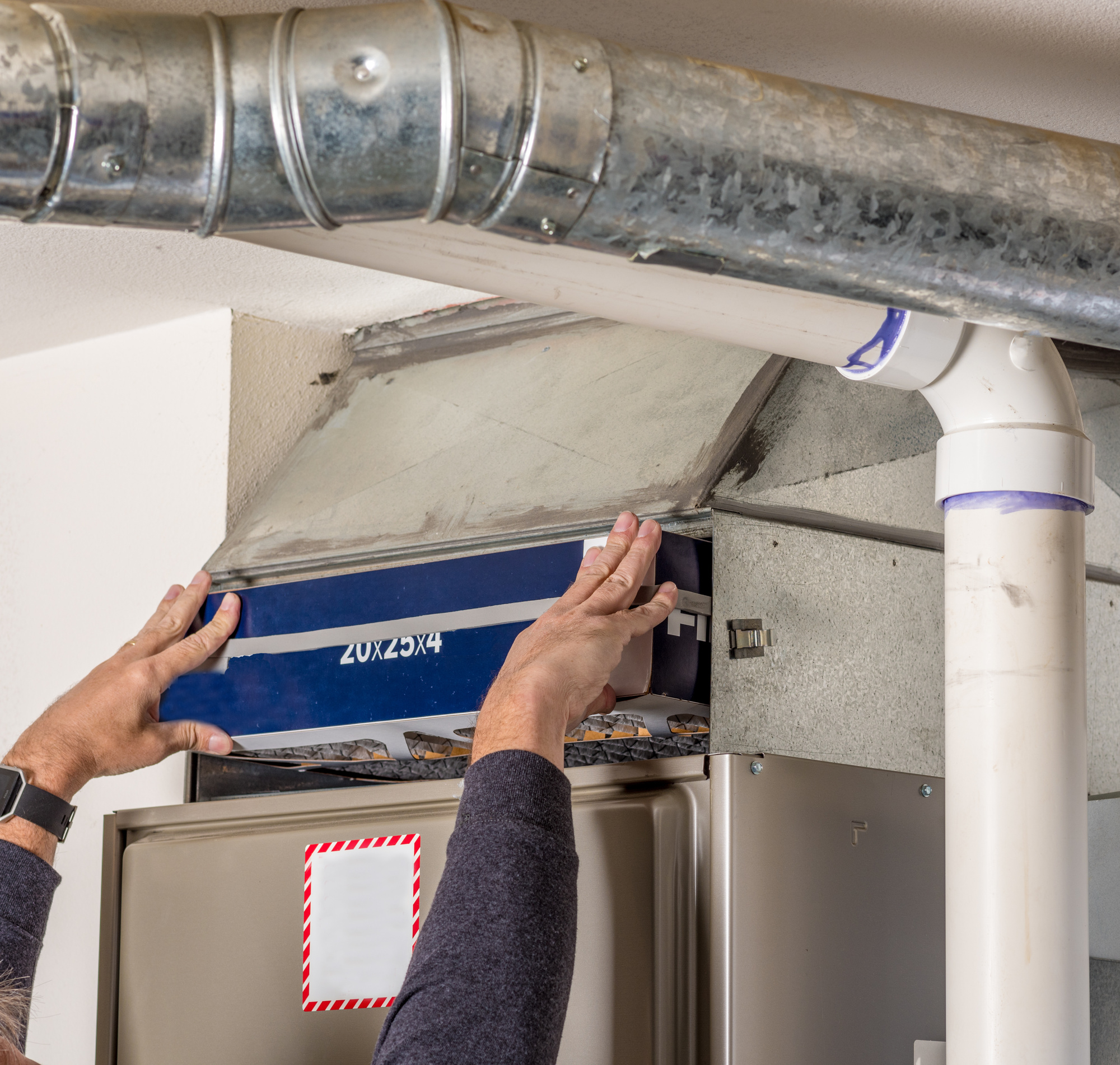 Person Installing a Furnace